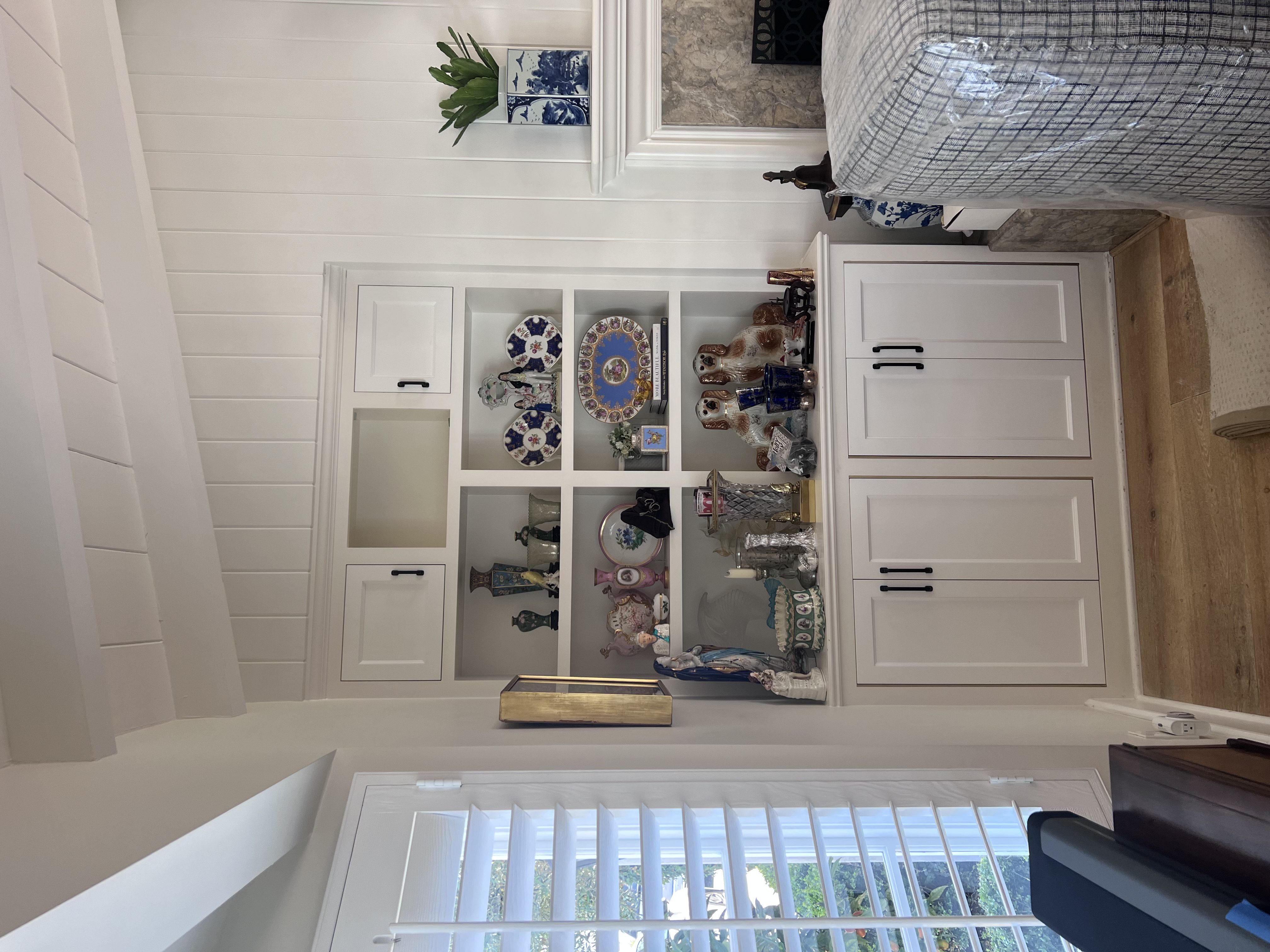 Built-in display cabinet with shiplap wall surround