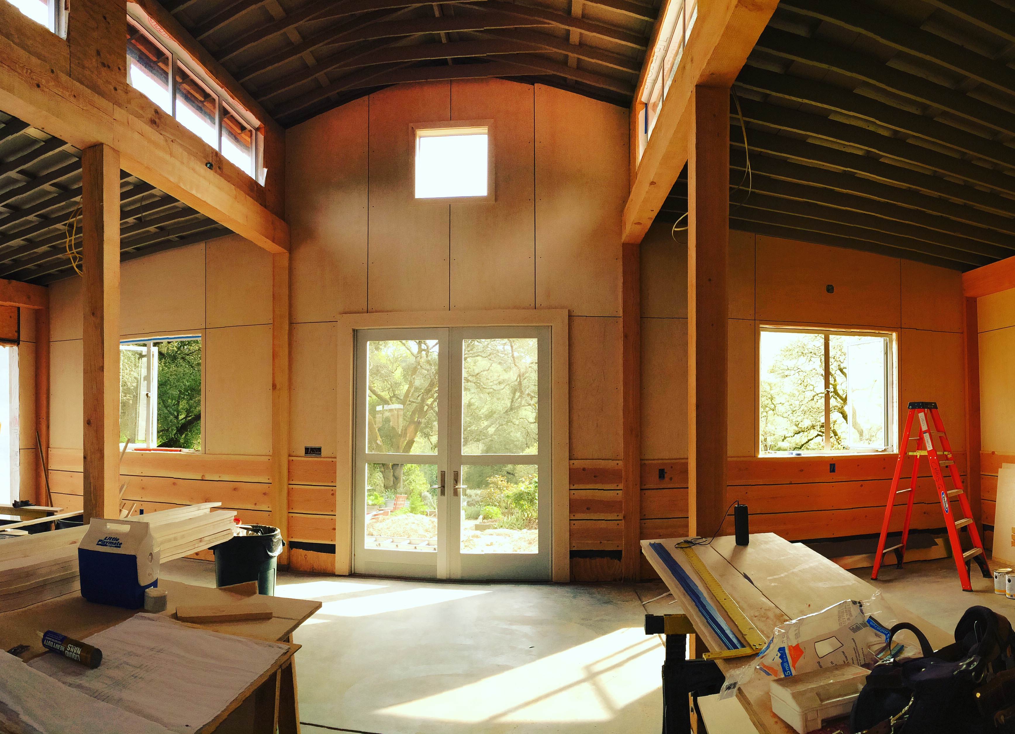 Structural timber framing with vaulted ceiling and custom windows