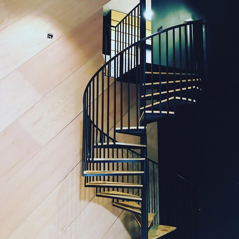 Custom spiral staircase with metal and wood construction